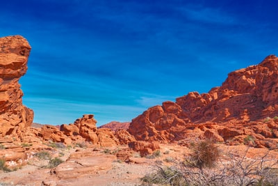 Brown rock strata under the blue sky during the day
